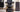 "Vintage and modern barber chairs side by side showing evolution of design"