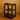Black three-tiered shelf against a beige wall with wooden paneling.