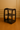 Black three-tiered shelf against a beige wall with wooden paneling.