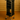 Black rolling cart with multiple shelves against a beige wall.